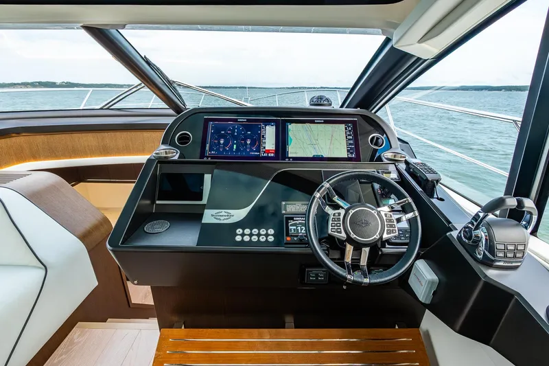 Slide: The Image of Helm of 2021 Sunseeker 60 Evo yacht with advanced navigation systems. - 62