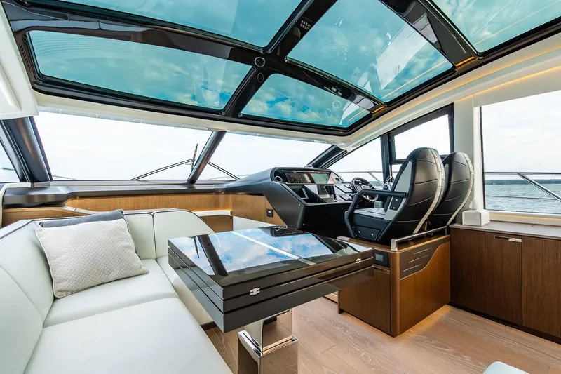 Slide: The Image of Luxurious interior of 2021 Sunseeker 60 Evo yacht with panoramic windows and modern seating. - 69