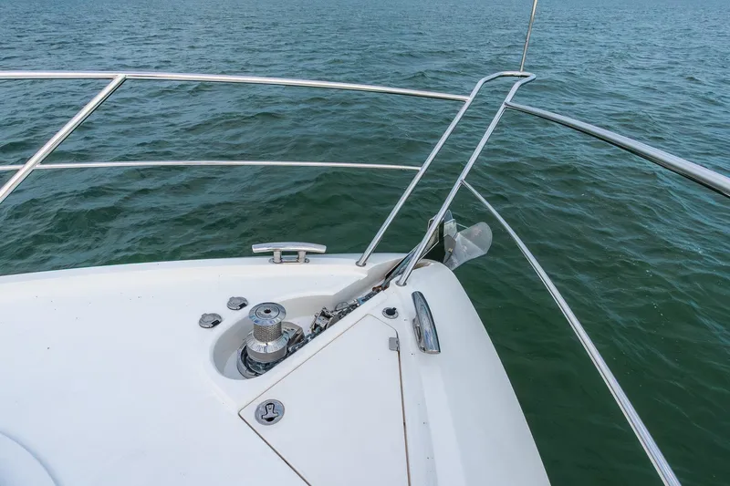 Slide: The Image of Bow of 2021 Sunseeker 60 Evo yacht with stainless steel railings on open water. - 73