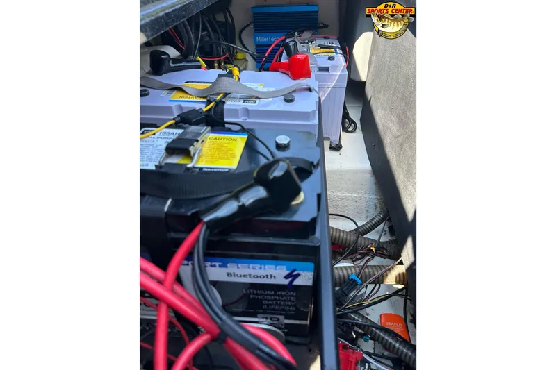 Slide: The Image of 2024 Nitro Z21 XL boat battery compartment with wiring and equipment. - 11