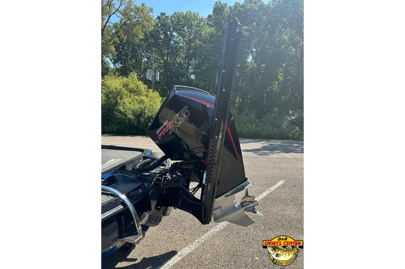 Slide: The Image of 2024 Nitro Z21 XL boat with Mercury Pro XS engine in a sunny outdoor setting. - 6