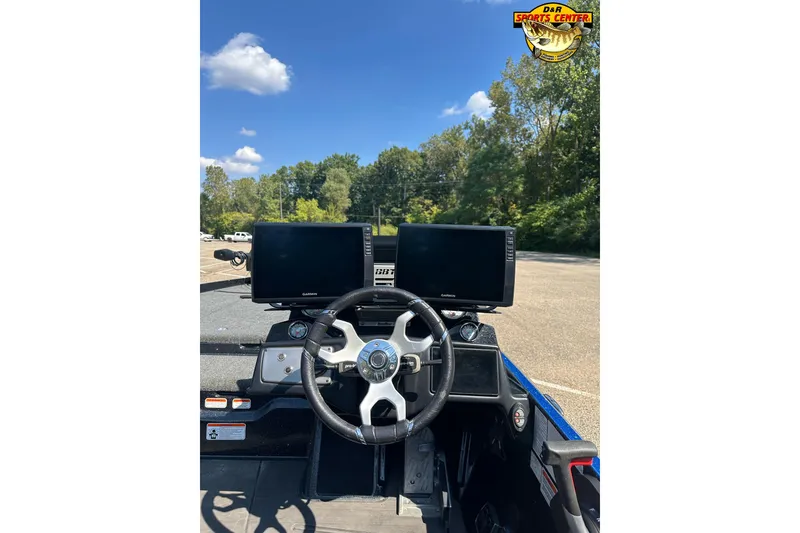 Slide: The Image of 2024 Nitro Z21 XL boat dashboard with dual Garmin displays and steering wheel. - 7