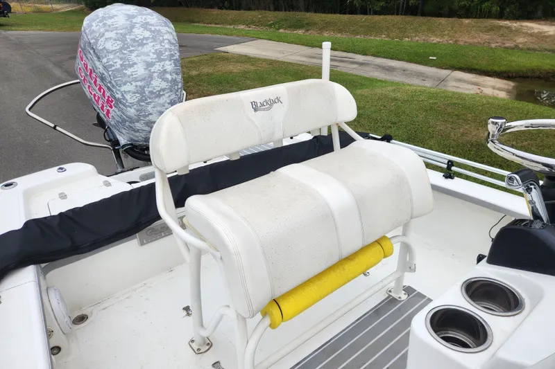 Slide: The Image of 2019 BlackJack 224 boat console with Garmin display and stainless steel steering wheel. - 11
