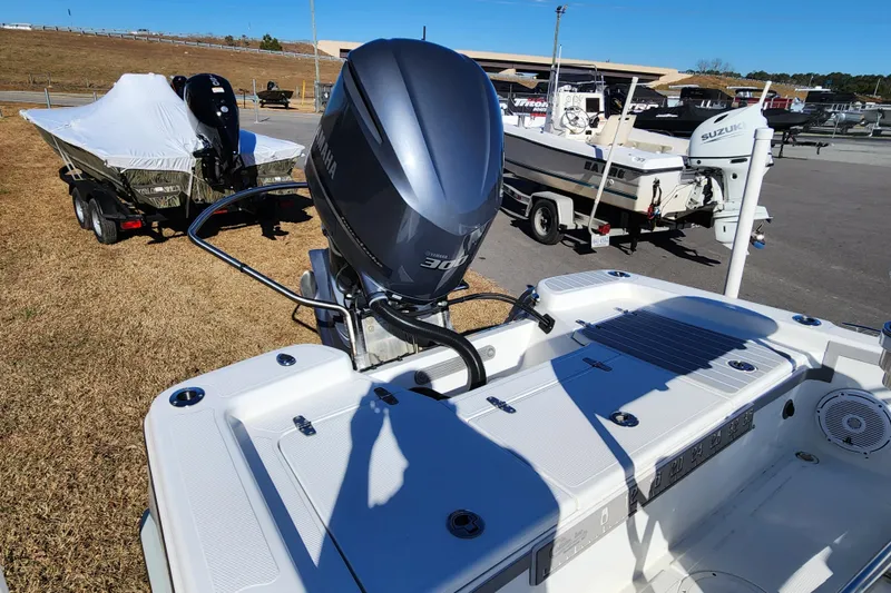 Slide: The Image of 2019 BlackJack 224 boat with Yamaha 300 outboard motor in a marina setting. - 13