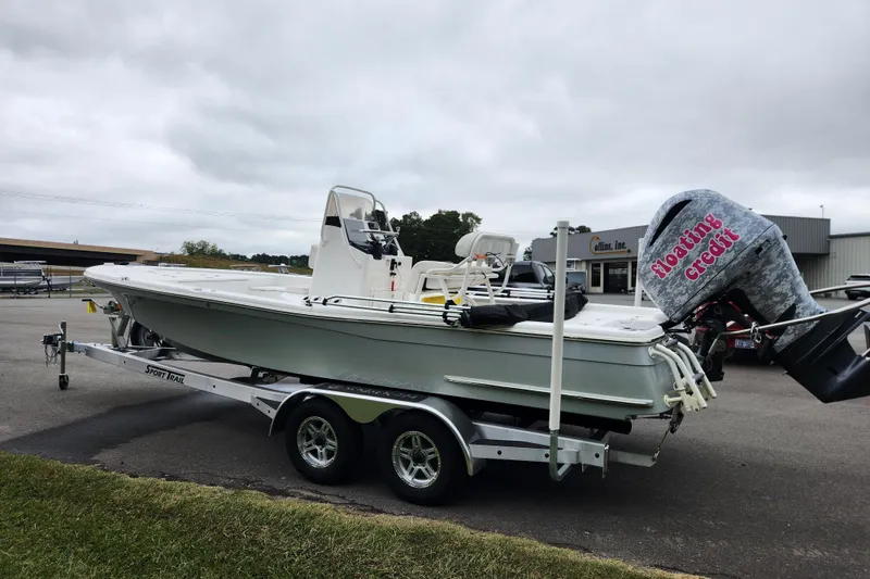 Slide: The Image of 2019 BlackJack 224 boat with Yamaha engine on trailer, parked outdoors. - 5