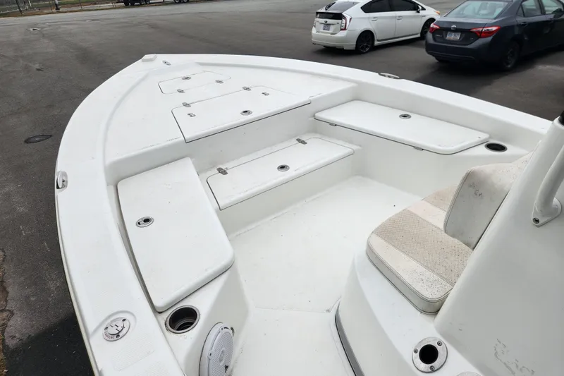 Slide: The Image of 2019 BlackJack 224 boat interior with seating and storage compartments. - 8