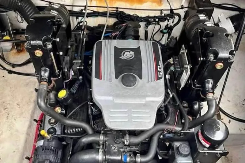 Slide: The Image of Engine of 2009 Sea Ray 230 Sundancer boat, showcasing detailed components and layout. - 16