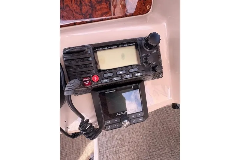 Slide: The Image of Control panel of a 2004 Sea Ray 320 Sundancer with radio and audio system. - 8