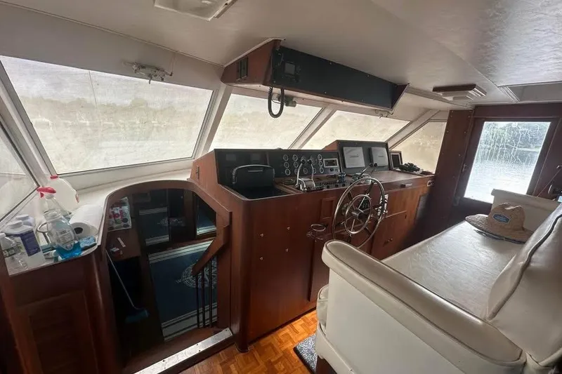 Slide: The Image of Interior of 1975 Pacemaker 62 Motor Yacht with helm, steering wheel, and navigation equipment. - 4
