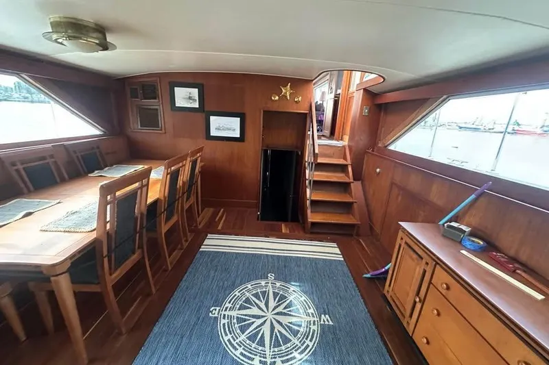 Slide: The Image of Interior of 1975 Pacemaker 62 Motor Yacht with dining area and nautical decor. - 5