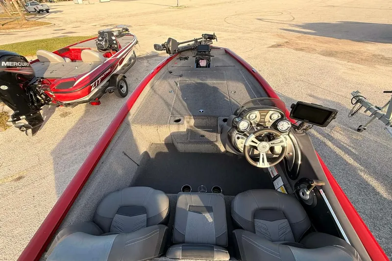 Slide: The Image of 2019 Tracker Pro Team 190 TX Tournament Edition boat interior with steering console and seating. - 2