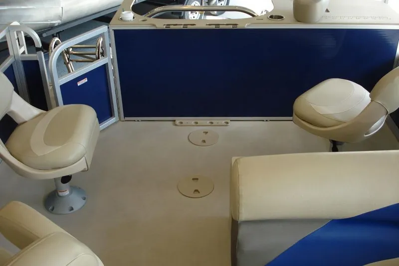 Slide: The Image of Interior of 2013 Manitou Aurora 22 VP pontoon boat with beige seating. - 3