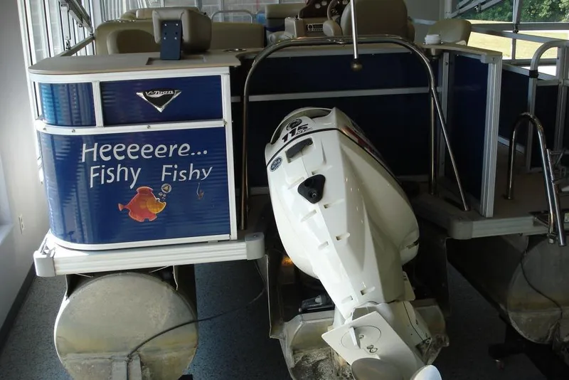 Slide: The Image of 2013 Manitou Aurora 22 VP pontoon boat with humorous "Heeeere... Fishy Fishy" decal. - 9