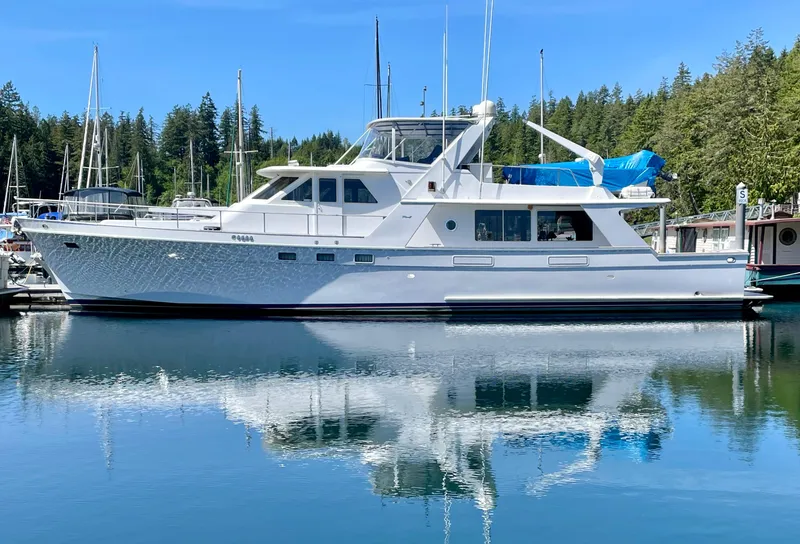 The Image of 1987 Tollycraft Pilothouse Motor Yacht docked in serene marina setting. - 0