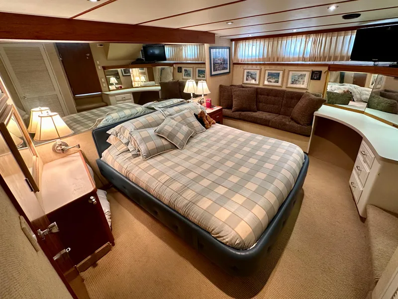 Slide: The Image of Luxurious bedroom in 1987 Tollycraft Pilothouse Motor Yacht with cozy bed and elegant decor. - 13
