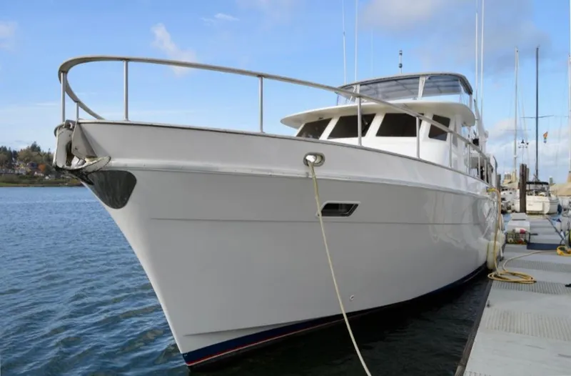 Slide: The Image of 1987 Tollycraft Pilothouse Motor Yacht docked at marina, showcasing sleek design and spacious deck. - 28
