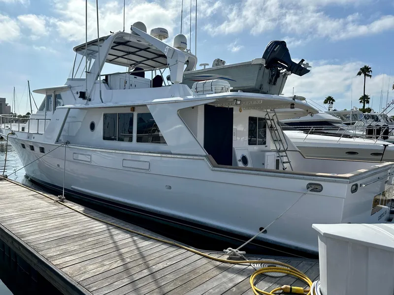 Slide: The Image of 1987 Tollycraft Pilothouse Motor Yacht docked at marina under blue sky. - 29