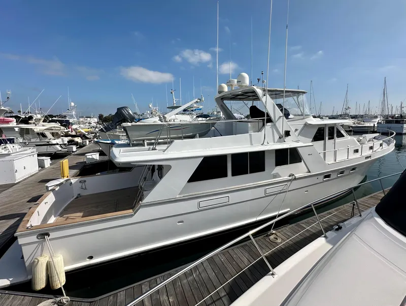 Slide: The Image of 1987 Tollycraft Pilothouse Motor Yacht docked at marina under clear blue sky. - 30