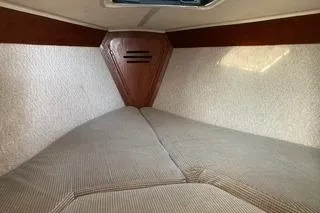 Slide: The Image of 1985 Tartan 28 Piper sailboat interior cabin with cozy sleeping area. - 14