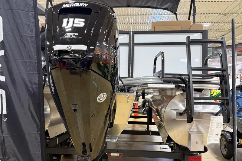 Slide: The Image of 2026 Lowe LS 210 boat with Mercury 115 GT engine displayed indoors. - 3