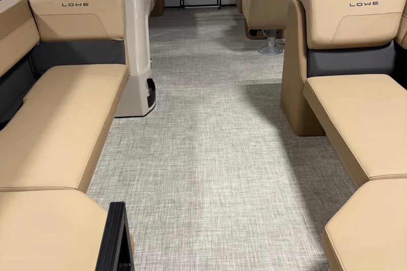 Slide: The Image of 2026 Lowe LS 210 boat interior with beige seating and modern flooring. - 5