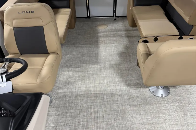 Slide: The Image of Interior of 2026 Lowe LS 210 boat with beige seating and modern design. - 7