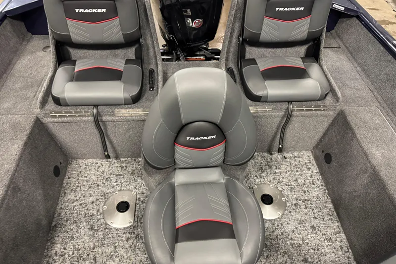 Slide: The Image of 2025 Tracker Pro Guide V-175 Combo boat interior with gray and black seating. - 10