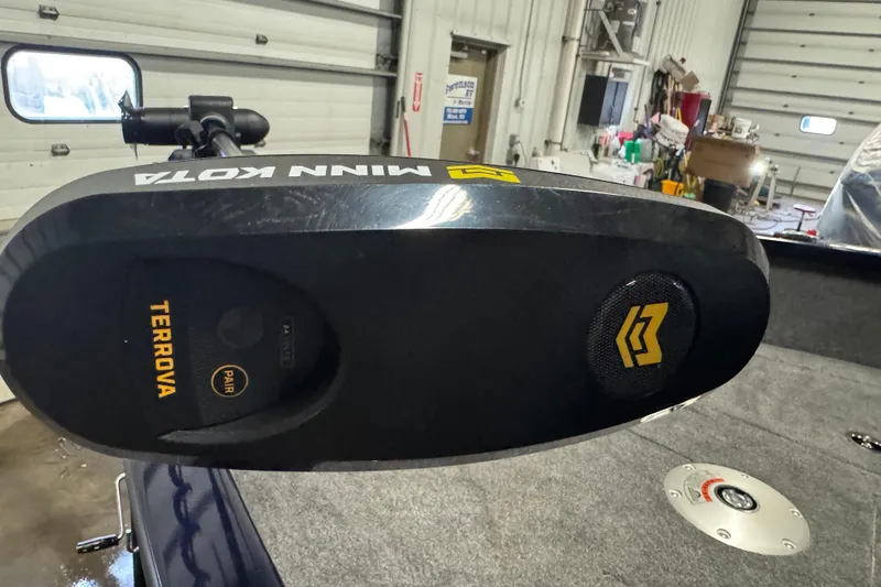 Slide: The Image of 2025 Tracker Pro Guide V-175 Combo with Minn Kota Terrova motor in a garage setting. - 14