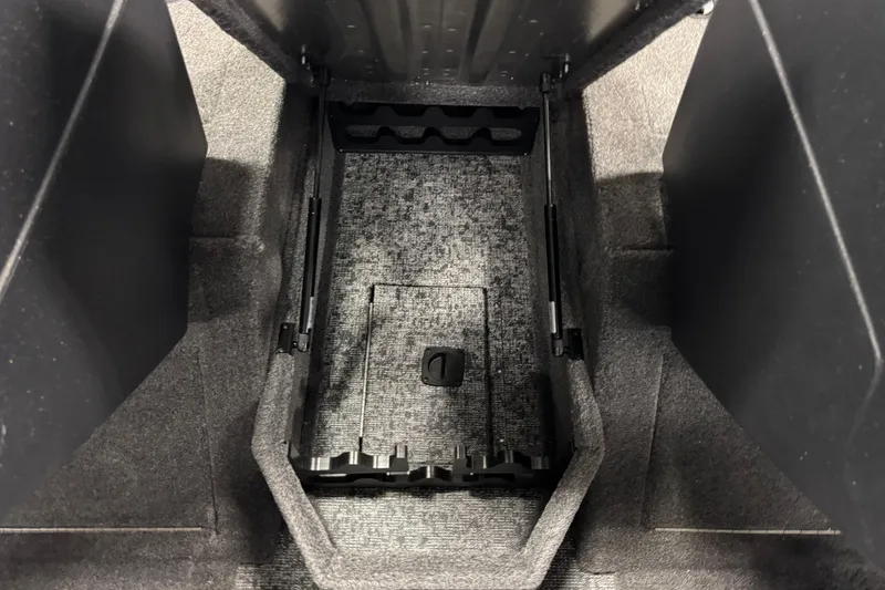 Slide: The Image of 2025 Tracker Pro Guide V-175 Combo interior storage compartment with carpeted finish. - 19