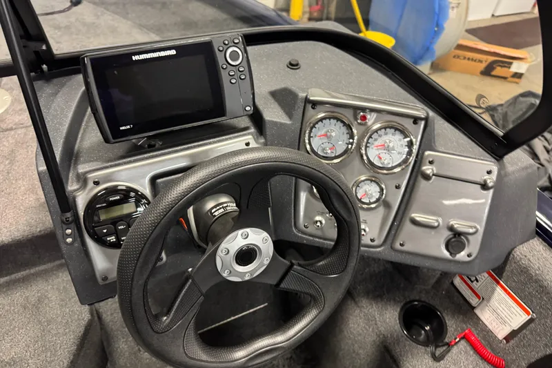 Slide: The Image of 2025 Tracker Pro Guide V-175 Combo dashboard with steering wheel and navigation display. - 7