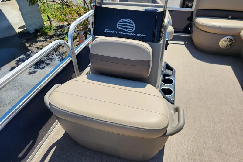 Slide: The Image of 2023 Sun Tracker Bass Buggy 16 XL Select boat seat with cup holders and console. - 9