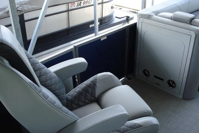 Slide: The Image of 2024 Manitou LX 25 RFX boat interior with luxurious seating and modern design. - 9