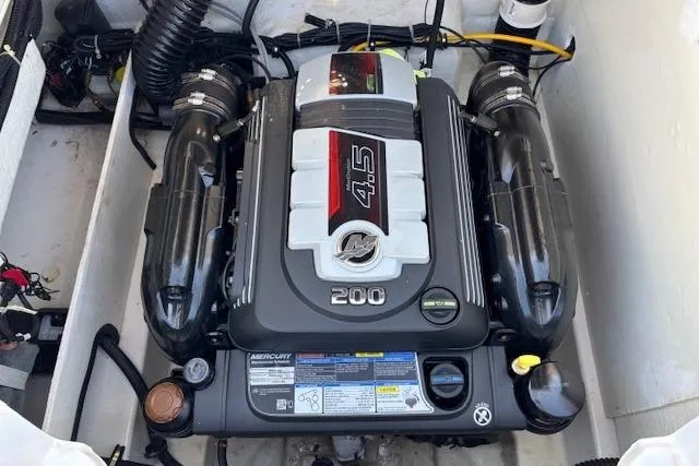 Slide: The Image of 2021 Bayliner VR5 Bowrider I/O engine compartment with MerCruiser 4.5L 200 HP engine. - 12