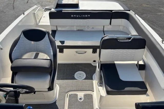 Slide: The Image of 2021 Bayliner VR5 Bowrider I/O interior with seating and steering wheel, showcasing modern design. - 6