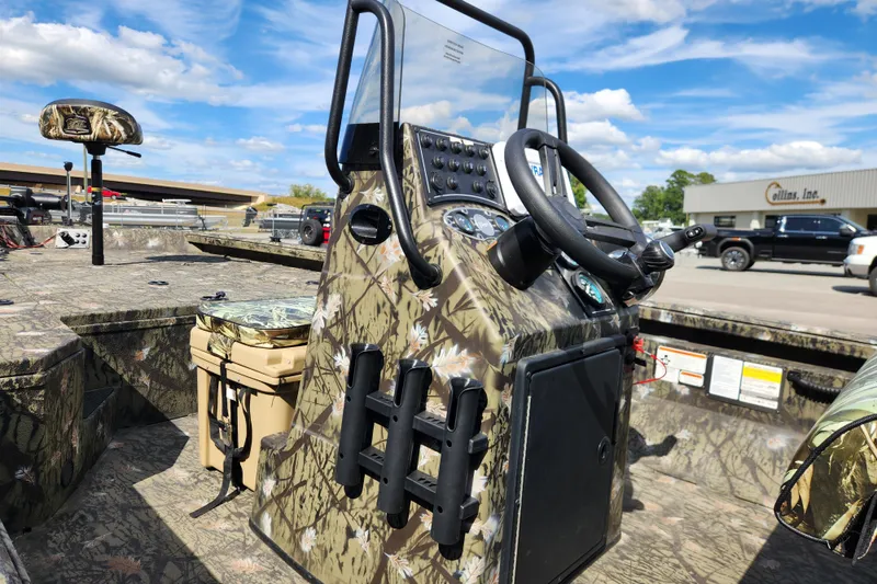 Slide: The Image of 2024 Ranger RB200 boat with camouflage design, featuring a steering console and seating. - 11