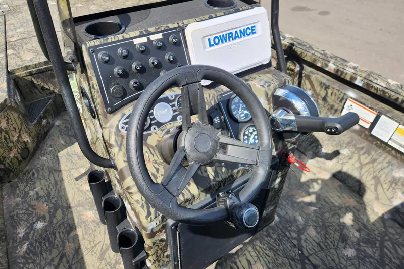 Slide: The Image of 2024 Ranger RB200 boat dashboard with steering wheel and control panel. - 12