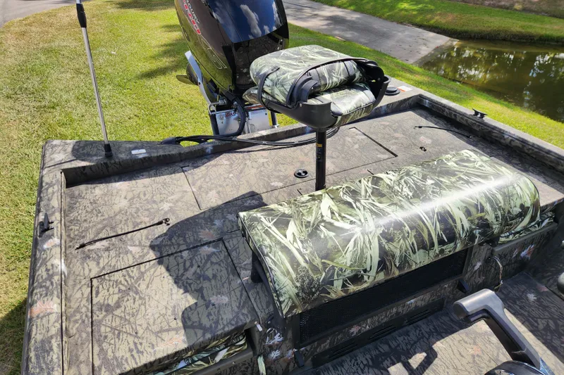 Slide: The Image of 2024 Ranger RB200 boat with camo seats and powerful outboard motor. - 13
