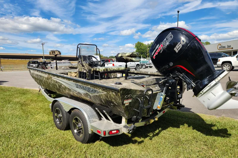 Slide: The Image of 2024 Ranger RB200 boat with camo design and powerful outboard motor on trailer. - 4