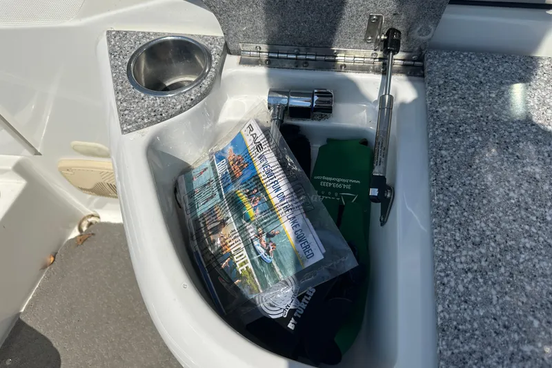 Slide: The Image of 2005 Formula 260 Bowrider storage compartment with tools and accessories. - 14