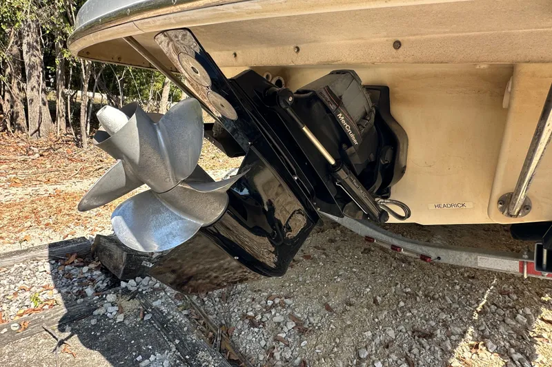 Slide: The Image of 2005 Formula 260 Bowrider boat with MerCruiser outdrive and dual propellers on a trailer. - 20