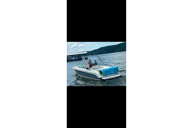 Slide: The Image of 2005 Formula 260 Bowrider boat with spacious seating and "Follow The Pipe" text on the back. - 6