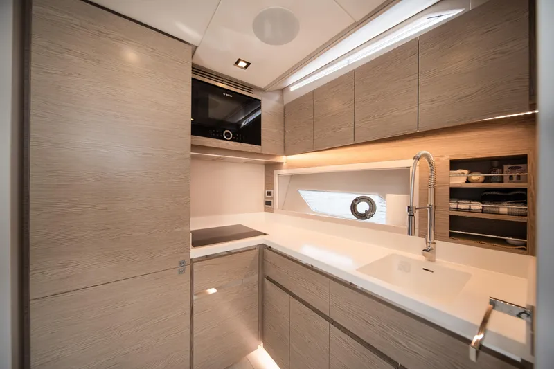 Slide: The Image of Luxurious 2019 Filippetti S55 yacht kitchen with modern cabinetry and sleek design. - 11