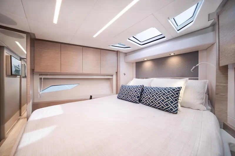 Slide: The Image of Luxurious 2019 Filippetti S55 yacht bedroom with modern design and skylights. - 19