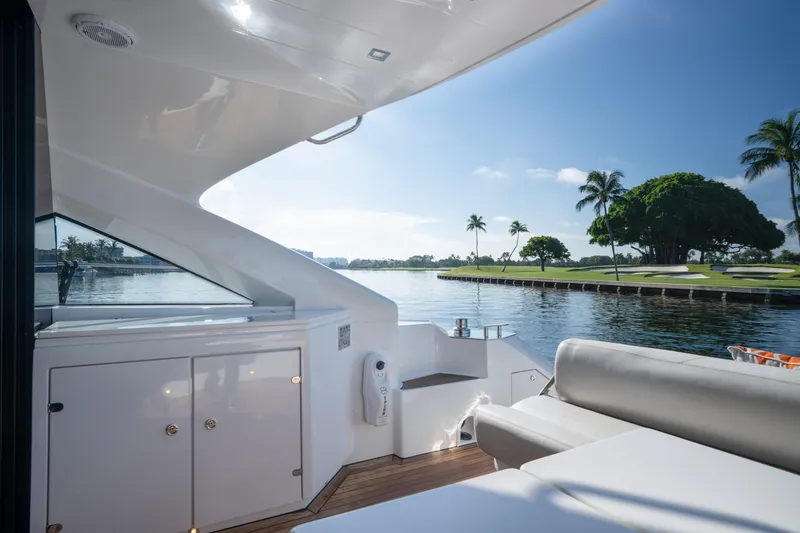 Slide: The Image of Luxurious 2019 Filippetti S55 yacht interior with scenic waterfront view and palm trees. - 22