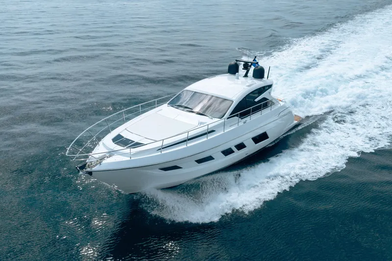 Slide: The Image of 2019 Filippetti S55 yacht cruising on open water, showcasing sleek design and performance. - 25