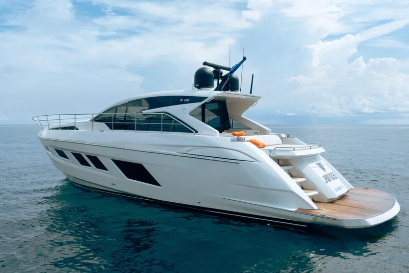 Slide: The Image of 2019 Filippetti S55 yacht on calm ocean waters under a partly cloudy sky. - 28