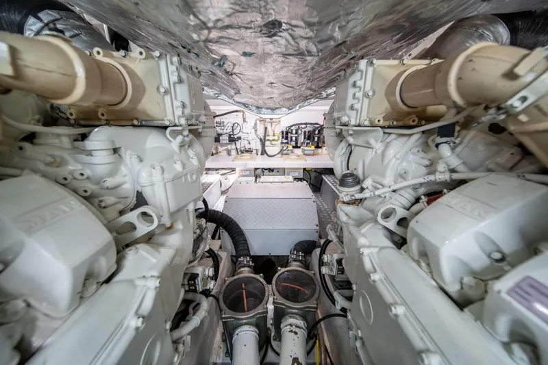 Slide: The Image of Engine room of 2019 Filippetti S55 yacht, showcasing dual engines and mechanical components. - 33