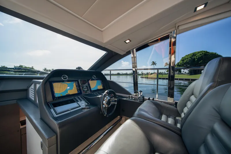 Slide: The Image of Luxurious 2019 Filippetti S55 yacht interior with modern navigation system and leather seating. - 7