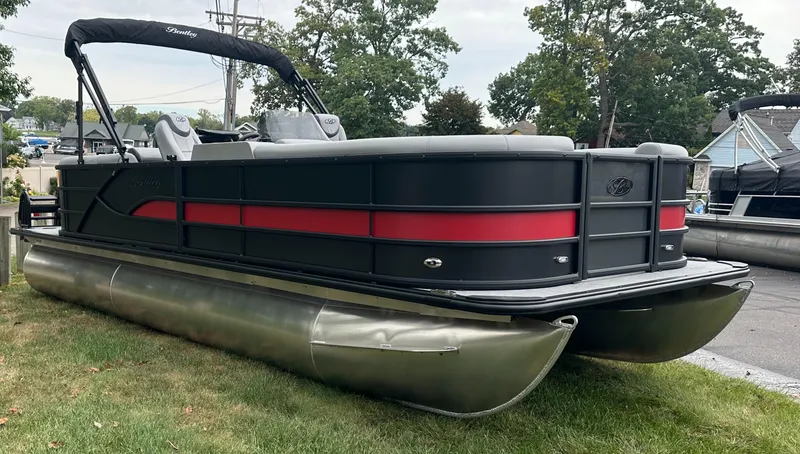The Image of 2025 Bentley Pontoons Legacy 220 Navigator on grass, showcasing sleek design and modern features. - 0