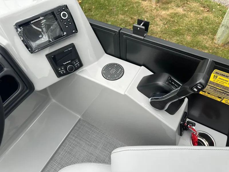 Slide: The Image of 2025 Bentley Pontoons Legacy 220 Navigator dashboard with controls and navigation system. - 13